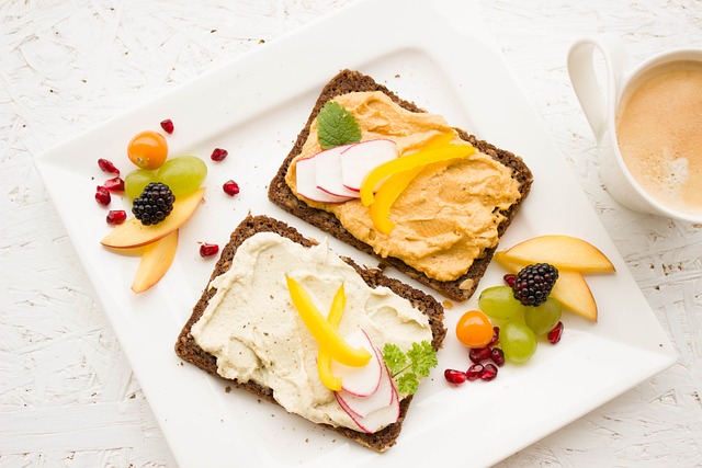 healthy breakfast toast with hummus and fruits and veggies