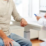 man discussing prostate surgery recovery with doctor