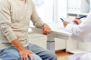 man discussing prostate surgery recovery with doctor